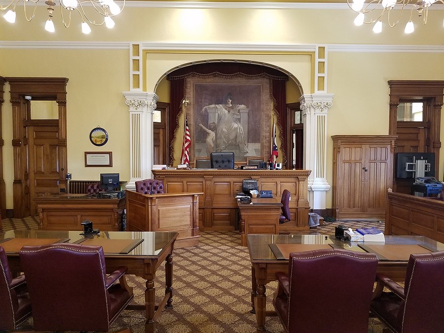A juvenile justice system courtroom with a judge presiding over a juvenile case
