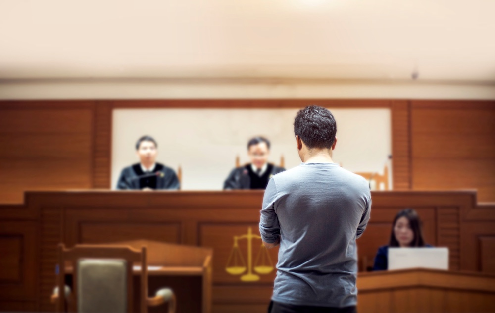 A person defending against criminal trespass charges in court